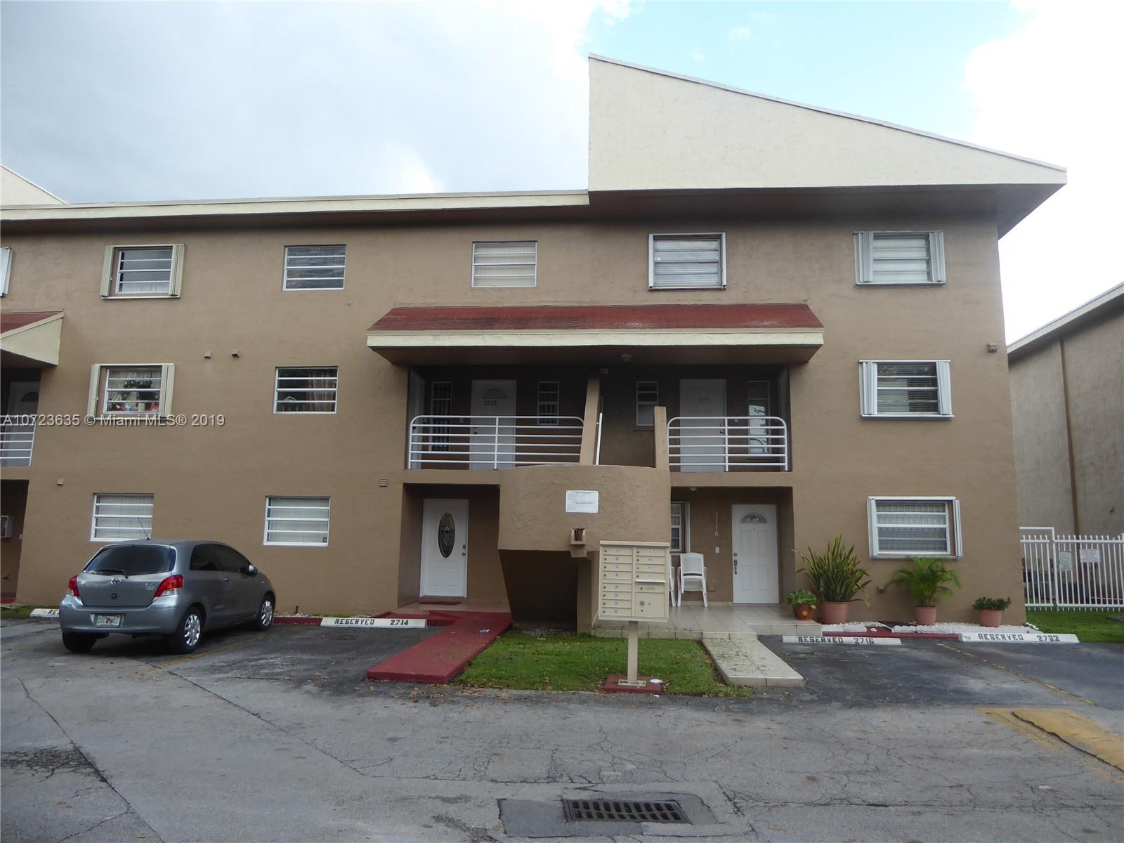 2726 West 60th Street, Unit 68 Hialeah, FL 33016 - Photo 23 of 23 a front view of a house with garage