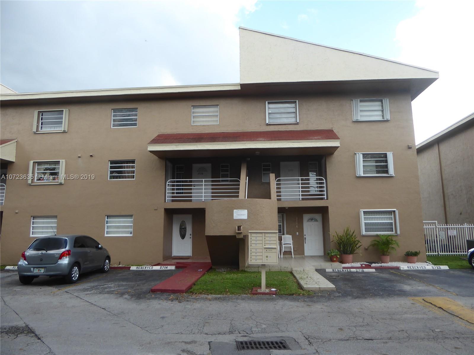 2726 West 60th Street, Unit 68 Hialeah, FL 33016 - Photo 4 of 23 a front view of a house with garage
