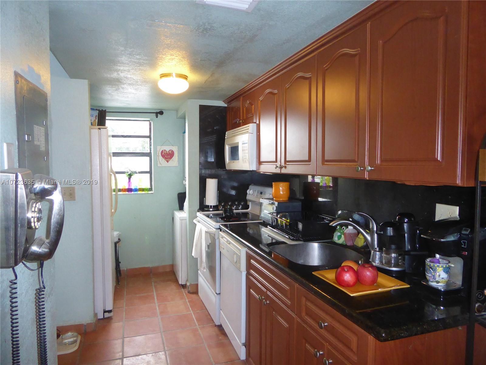 2726 West 60th Street, Unit 68 Hialeah, FL 33016 - Photo 5 of 23 a kitchen with stainless steel appliances granite countertop a sink stove and cabinets