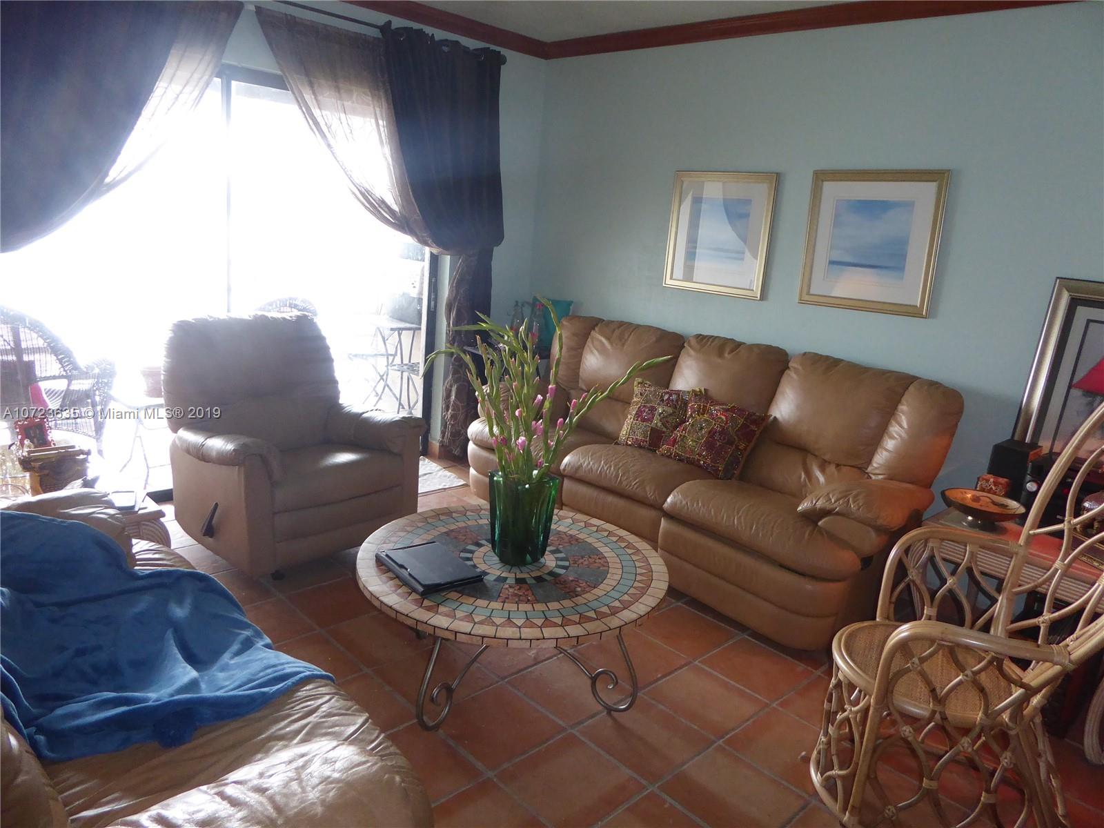 2726 West 60th Street, Unit 68 Hialeah, FL 33016 - Photo 8 of 23 a living room with furniture