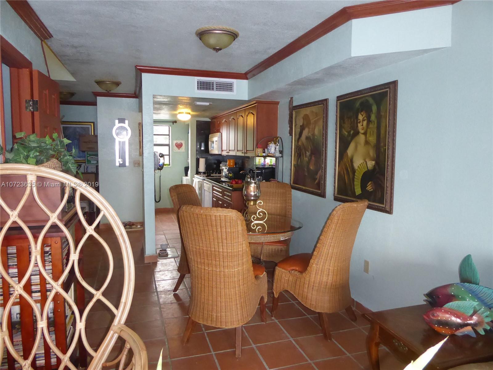 2726 West 60th Street, Unit 68 Hialeah, FL 33016 - Photo 9 of 23 a dining room with furniture and window