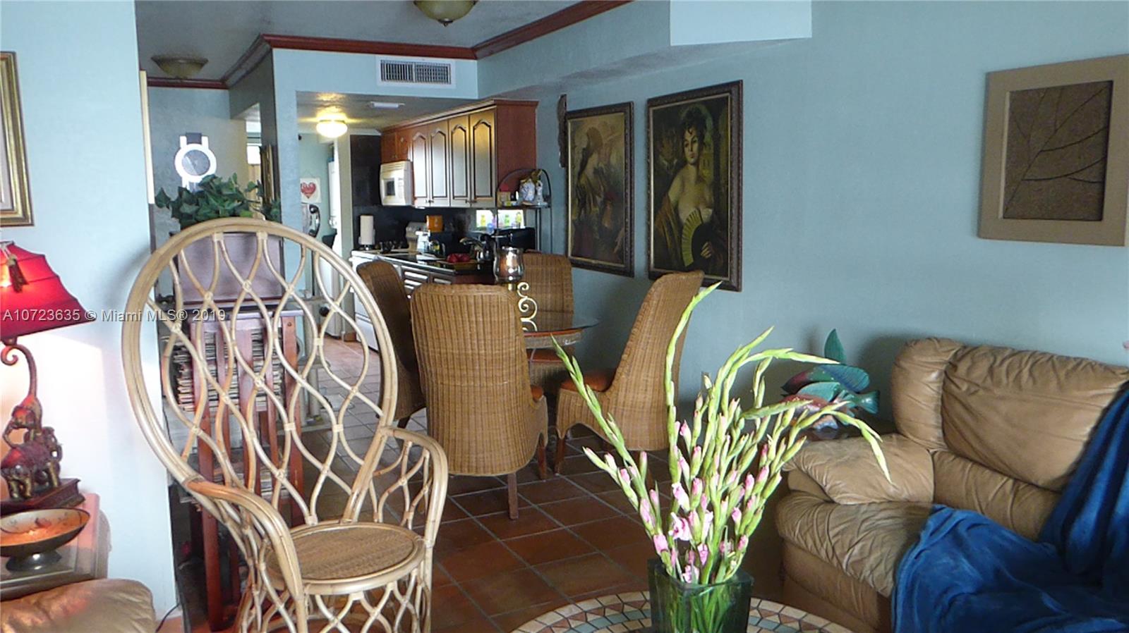 2726 West 60th Street, Unit 68 Hialeah, FL 33016 - Photo 10 of 23 a view of balcony with furniture and chandelier