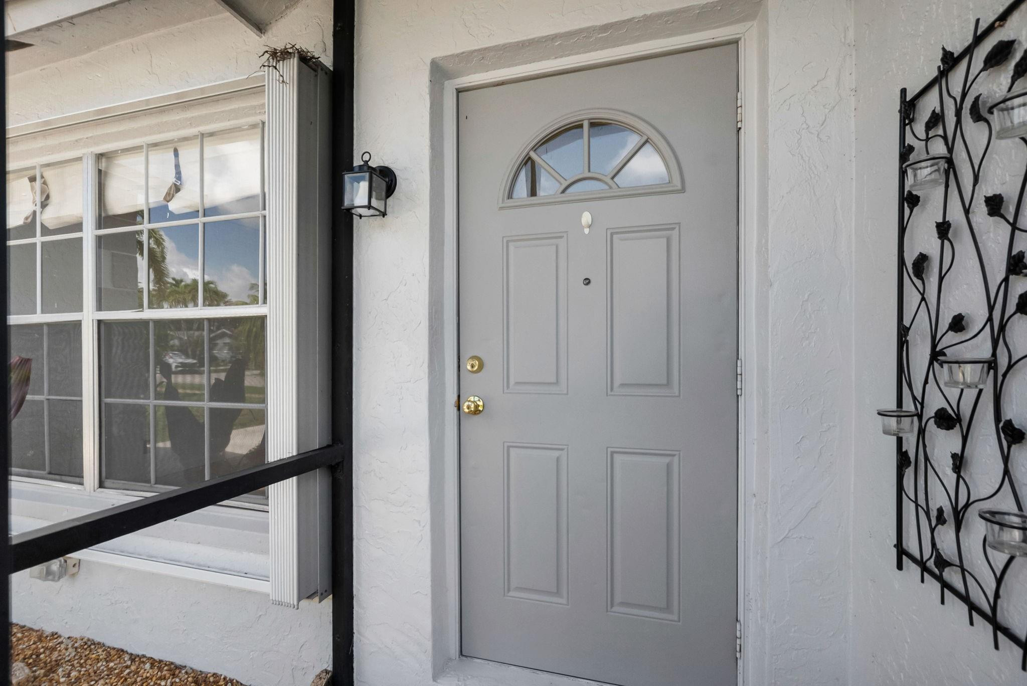 22750 Southwest 56th Avenue Boca Raton, FL 33433 - Photo 21 of 28 Screened front entry.