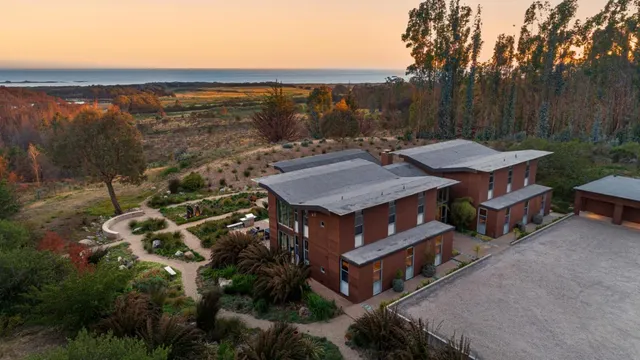 a view of an entryway wooden floor and door