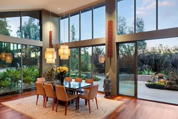 a view of a swimming pool with an outdoor seating area