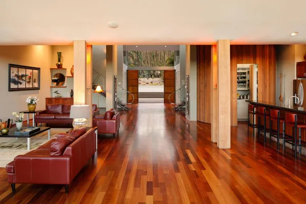 a living room with furniture and wooden floor