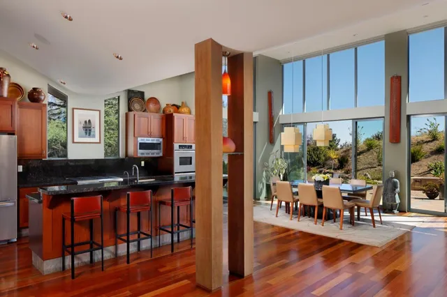 a view of a backyard with chairs and a small yard