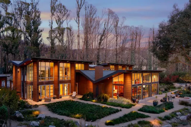 a view of outdoor sitting area with green trees