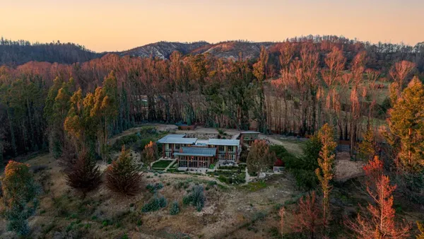 a bedroom with furniture and large window