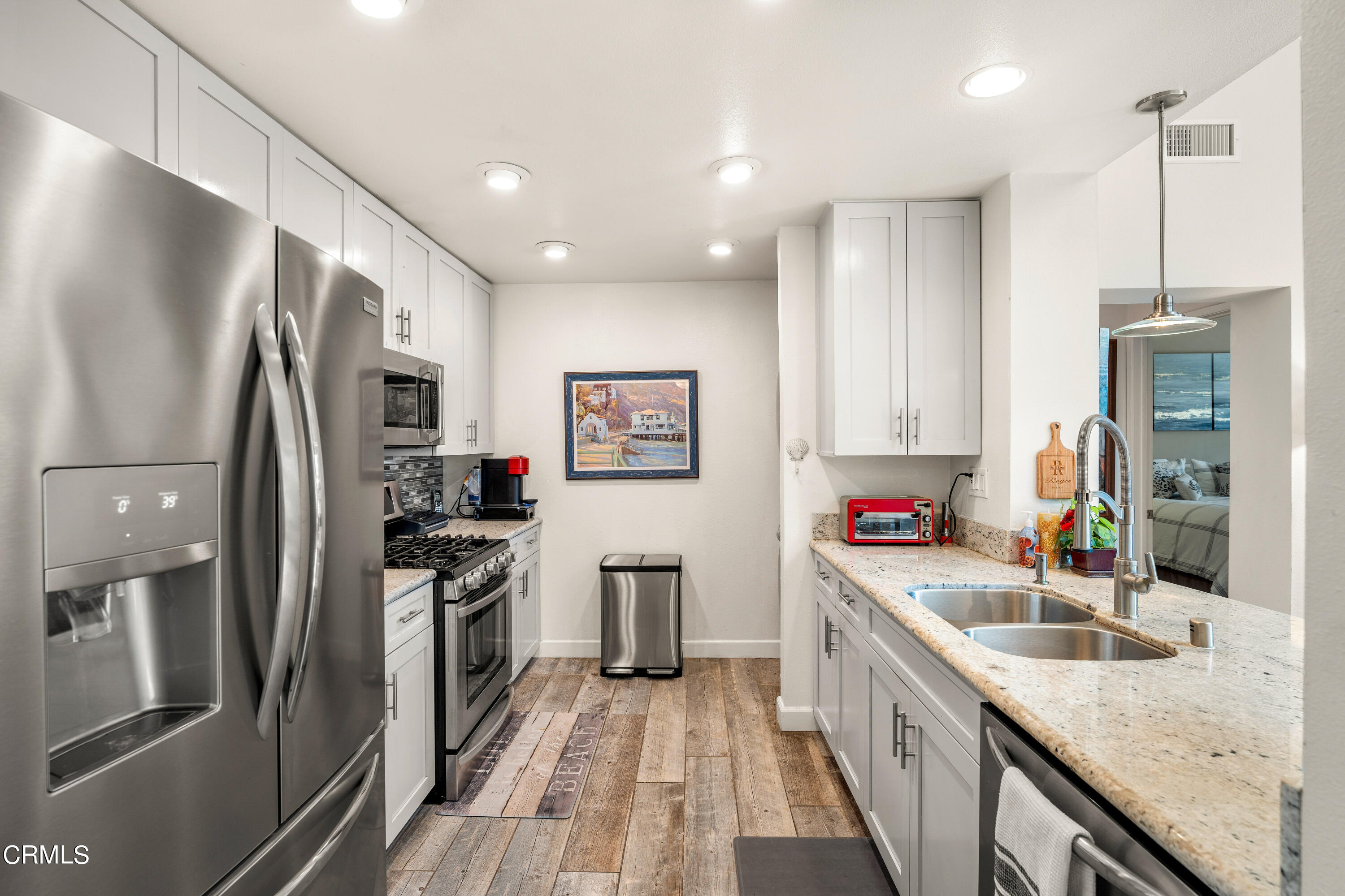 1971 Majorca Drive Oxnard, CA 93035 - Photo 17 of 44 a kitchen with stainless steel appliances granite countertop a refrigerator a stove and a sink