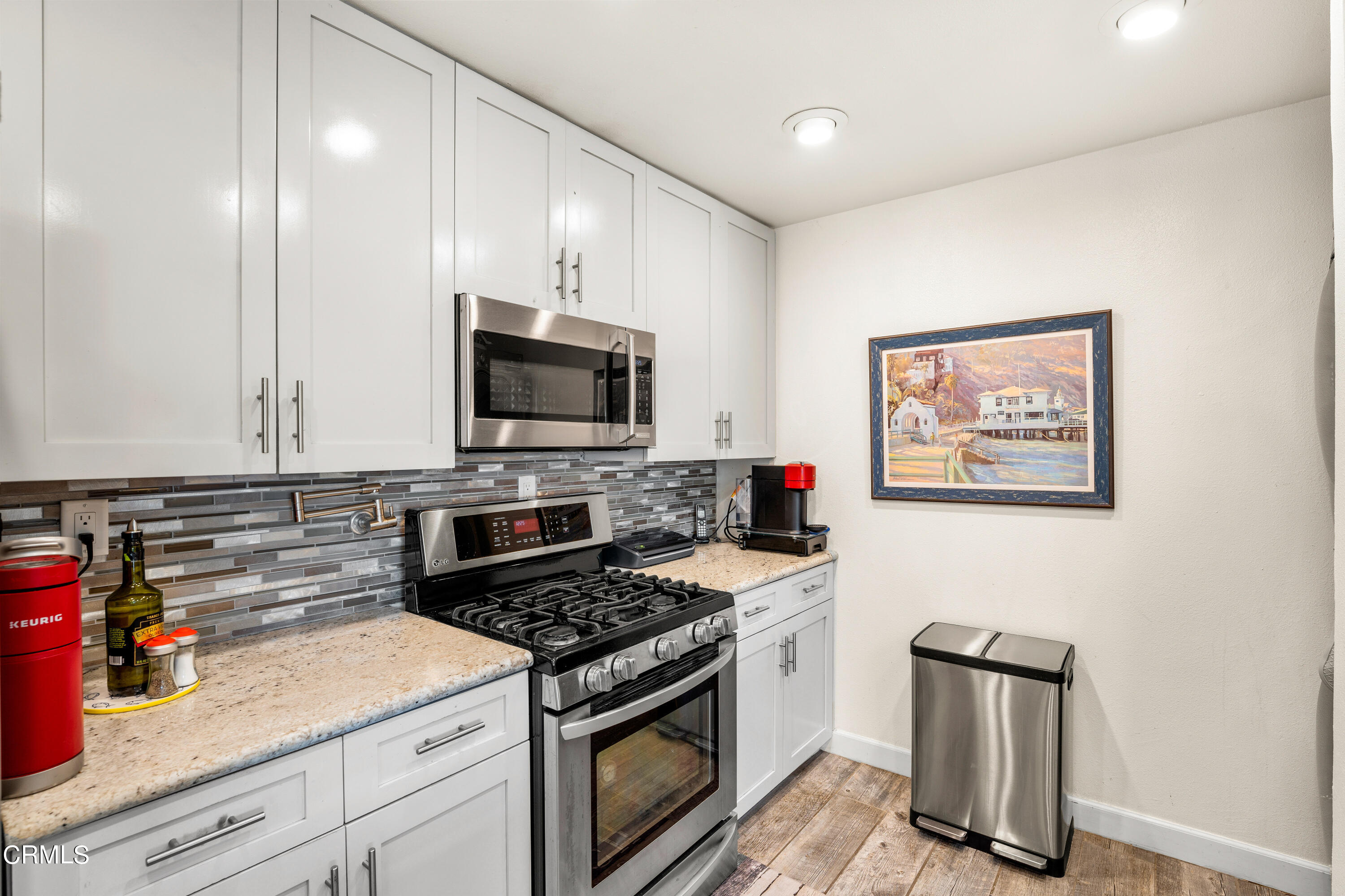 1971 Majorca Drive Oxnard, CA 93035 - Photo 18 of 44 a kitchen with stainless steel appliances granite countertop a stove and a refrigerator