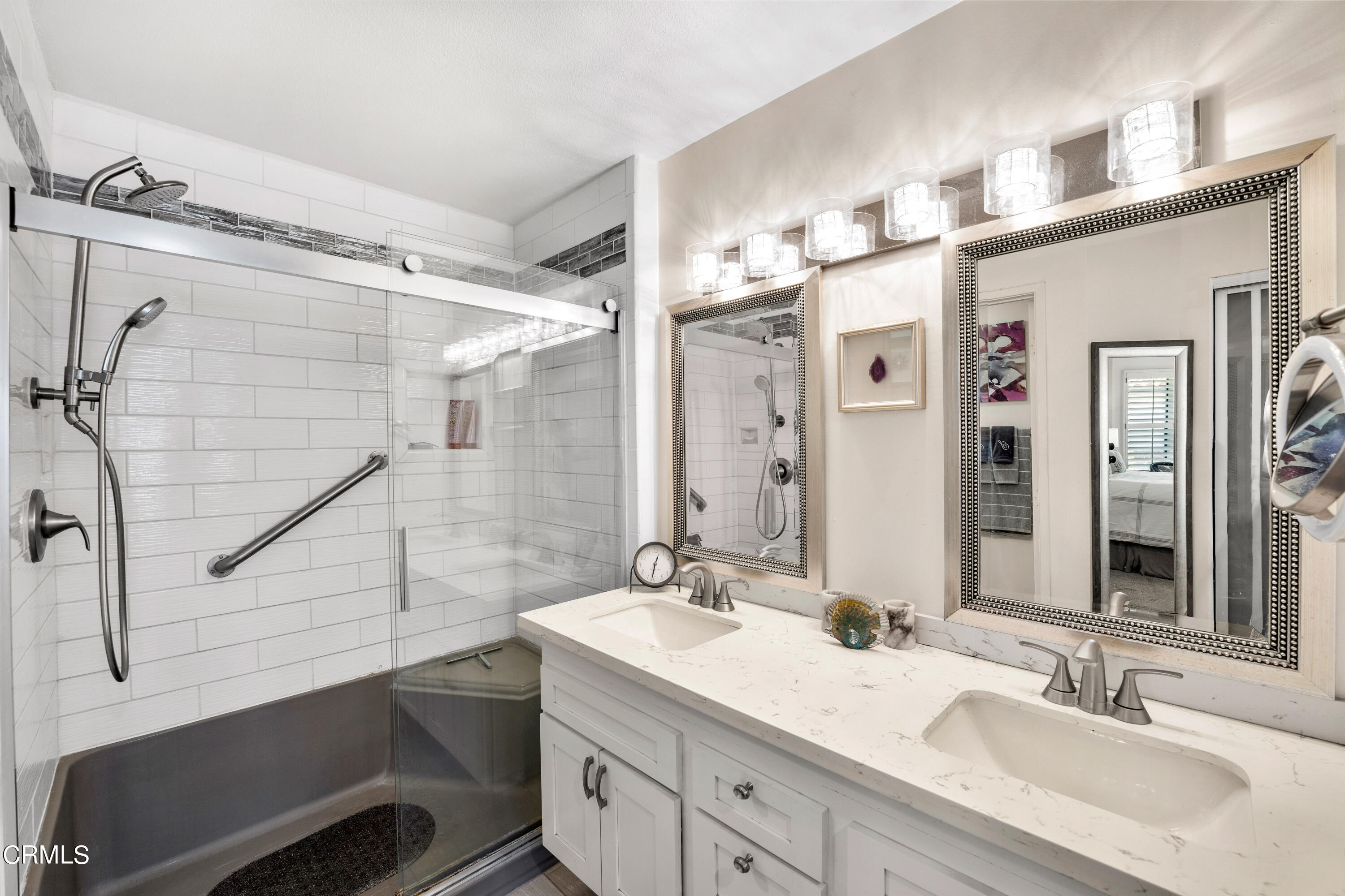 1971 Majorca Drive Oxnard, CA 93035 - Photo 22 of 44 a bathroom with a double vanity sink a mirror and a shower