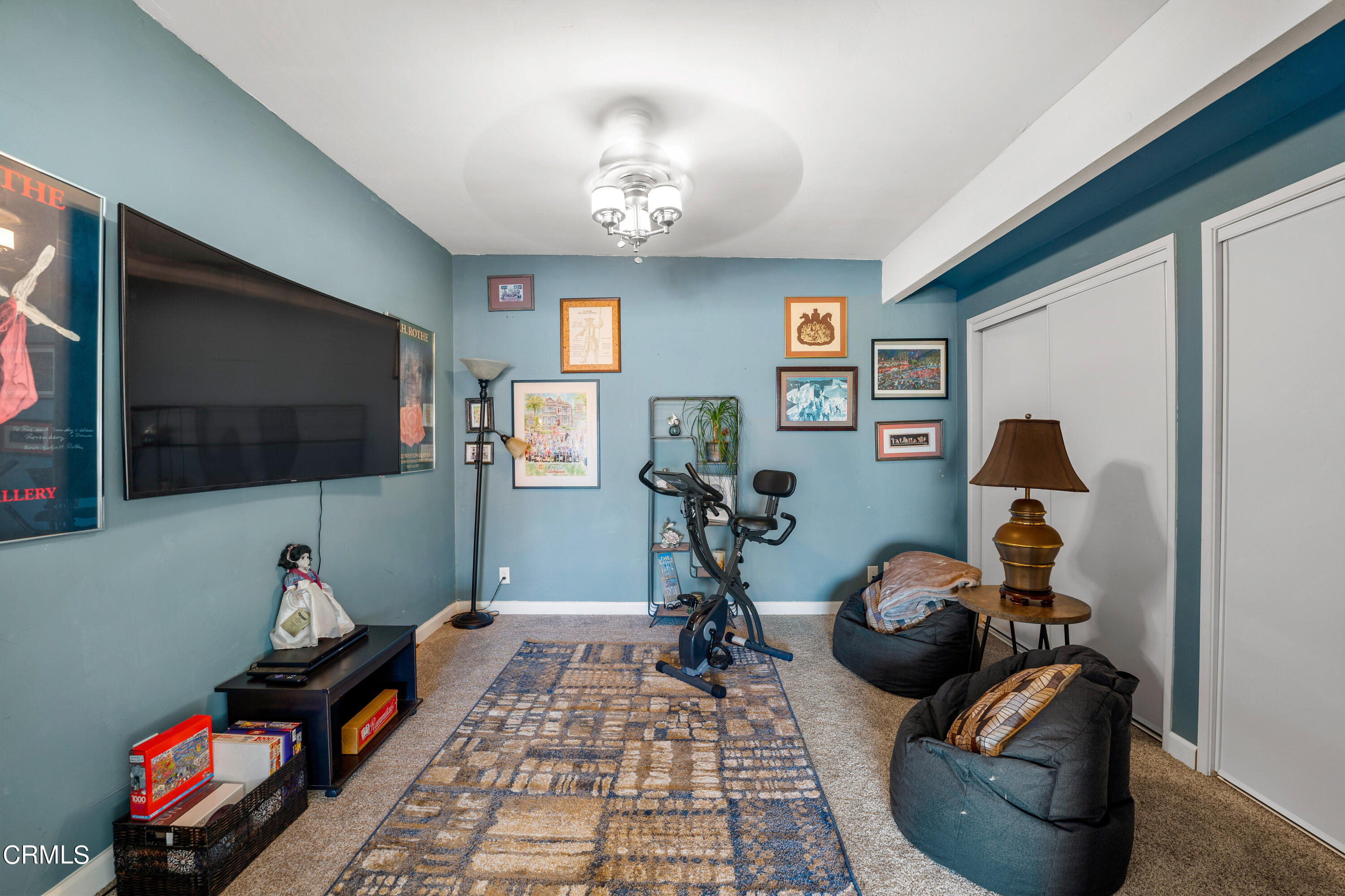 1971 Majorca Drive Oxnard, CA 93035 - Photo 28 of 44 a living room with furniture gym equipment and a flat screen tv