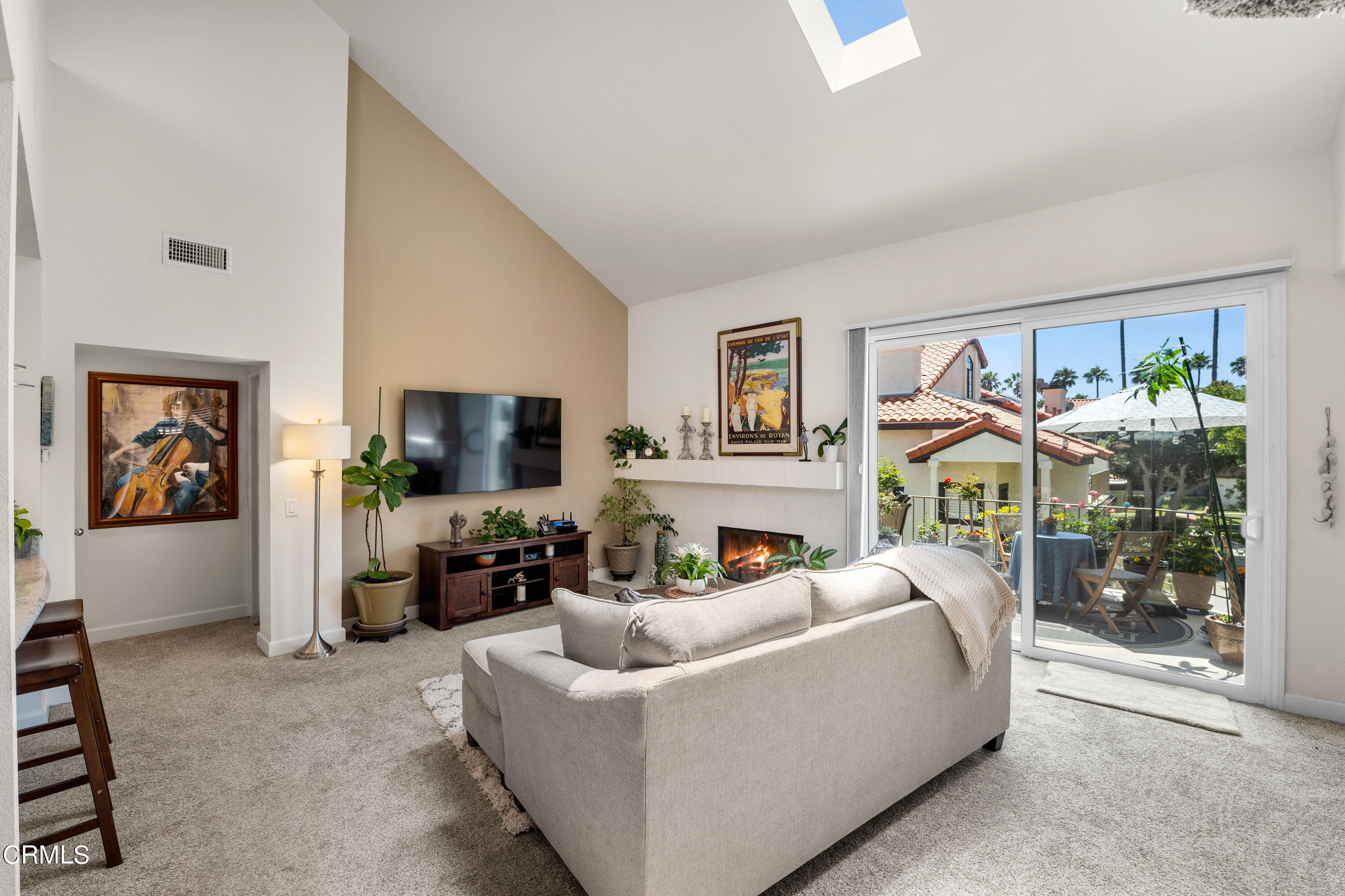 1971 Majorca Drive Oxnard, CA 93035 - Photo 10 of 44 a living room with furniture a flat screen tv and a floor to ceiling window