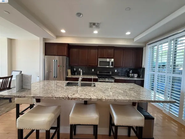 a utility room with a sink dryer and washer