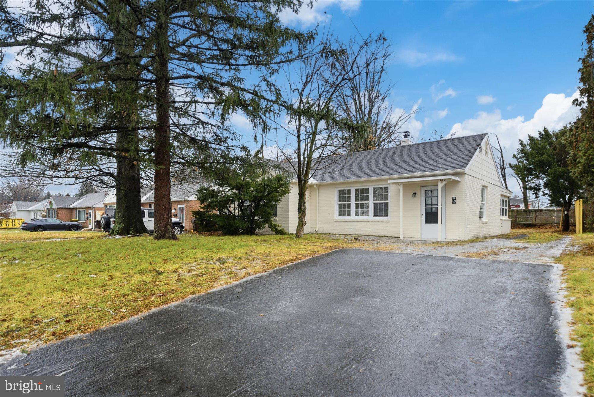 733 West County Line Road Horsham, PA 19044 - Photo 1 of 24 a view of a house with backyard and trees