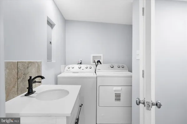 a utility room with dryer and washer