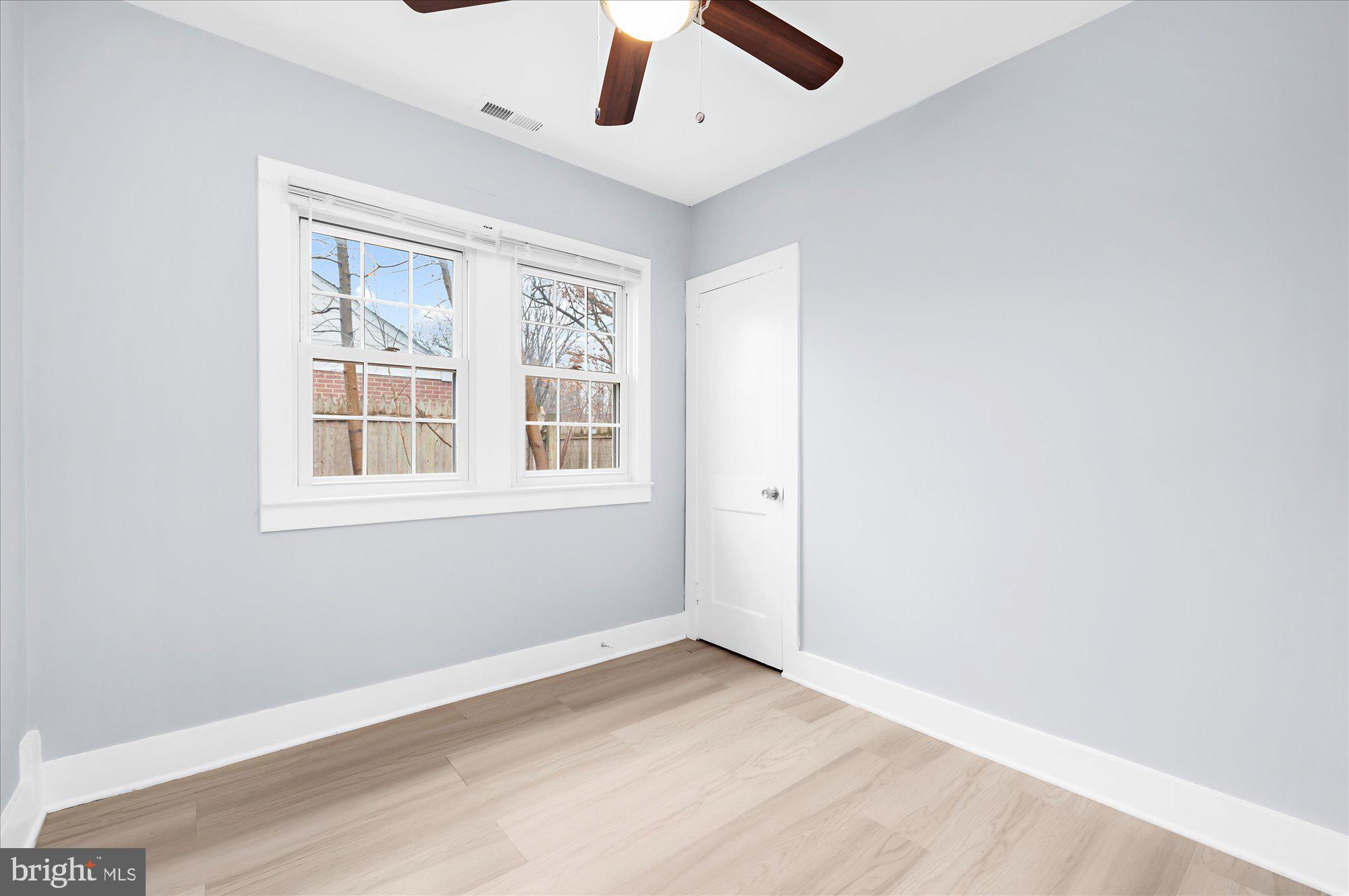 733 West County Line Road Horsham, PA 19044 - Photo 17 of 24 an empty room with a window and a ceiling fan