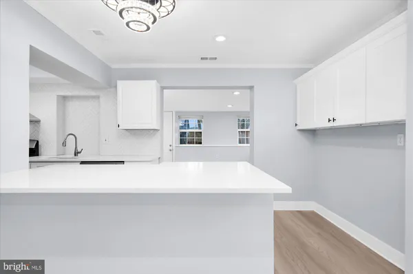 a close view of sink and cabinets