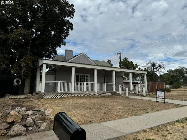 a view of front door deck and hardwood floor