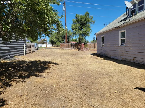 a view of a backyard of the house