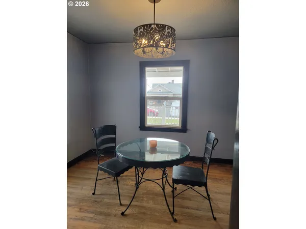 a dining room with a table and a window