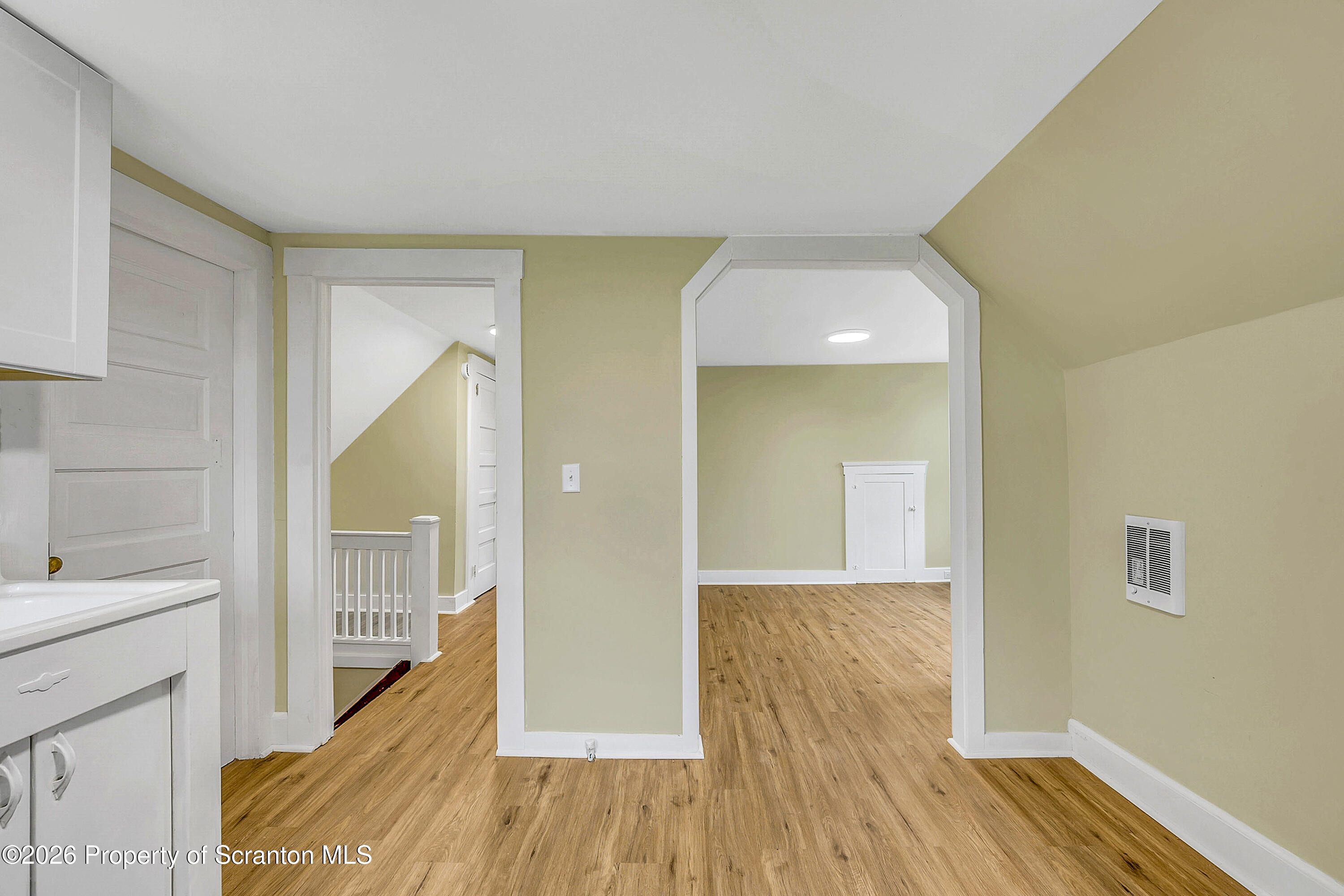 529 Wheeler Avenue, Unit 2 Scranton, PA 18510 - Photo 11 of 12 a view of a hallway with wooden floor and staircase
