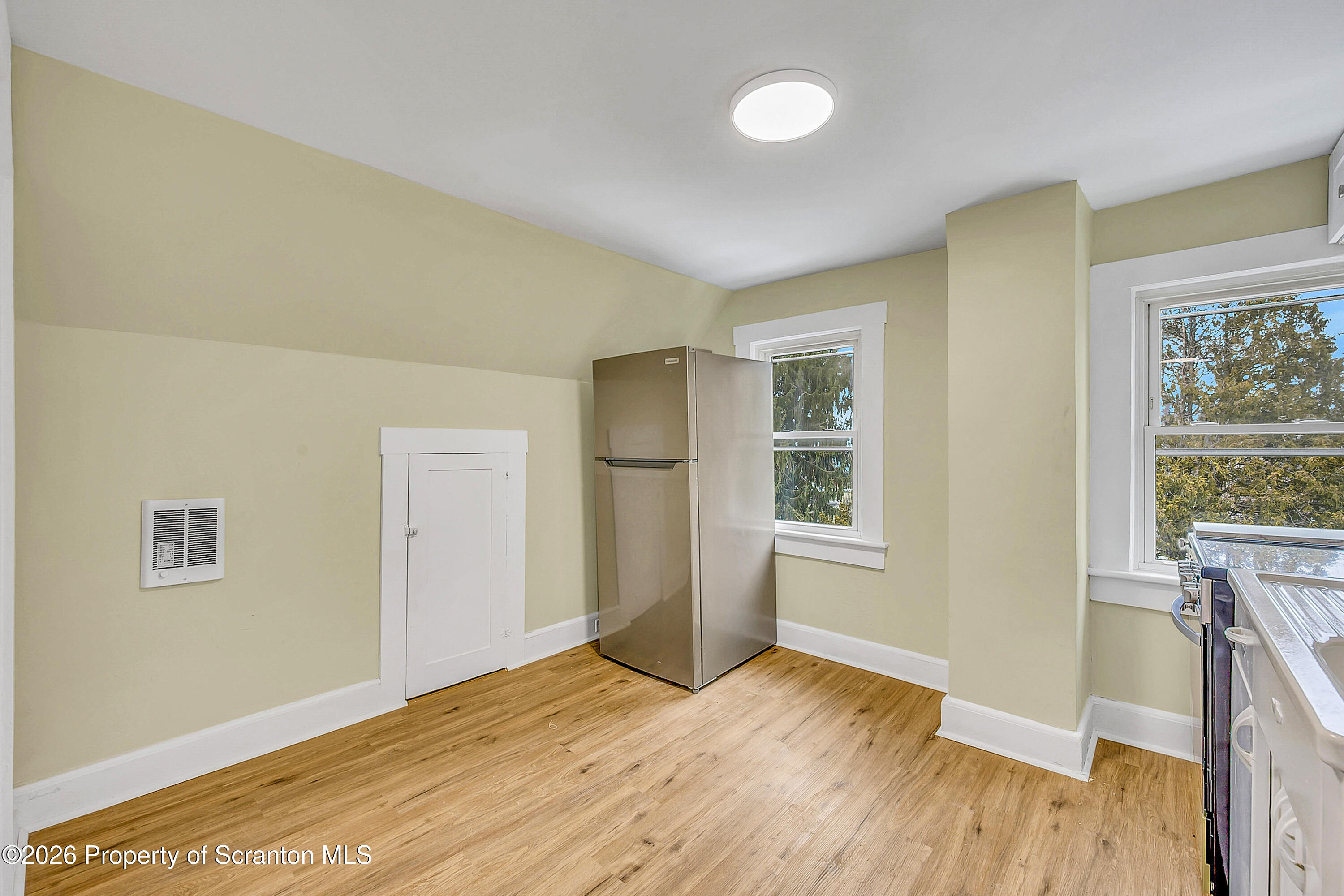 529 Wheeler Avenue, Unit 2 Scranton, PA 18510 - Photo 12 of 12 a view of empty room with wooden floor and fan