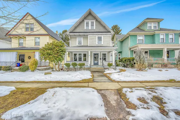 a front view of a house with swimming pool
