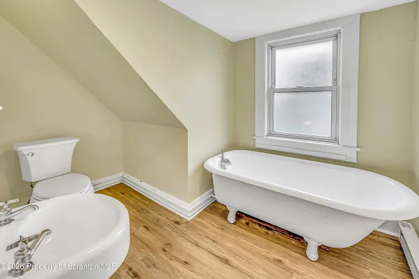 a bathroom with a sink and a toilet