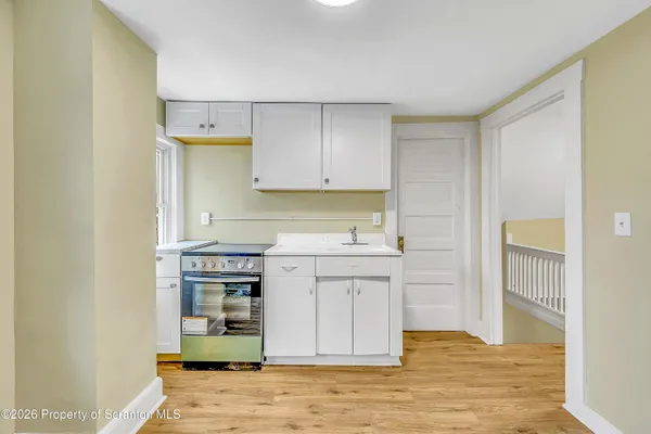 a kitchen with stainless steel appliances a stove and refrigerator
