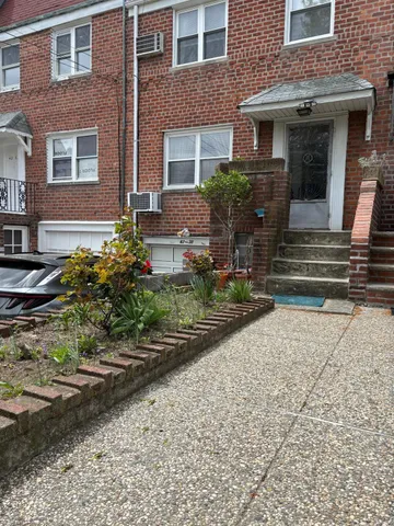 a front view of a house with stairs