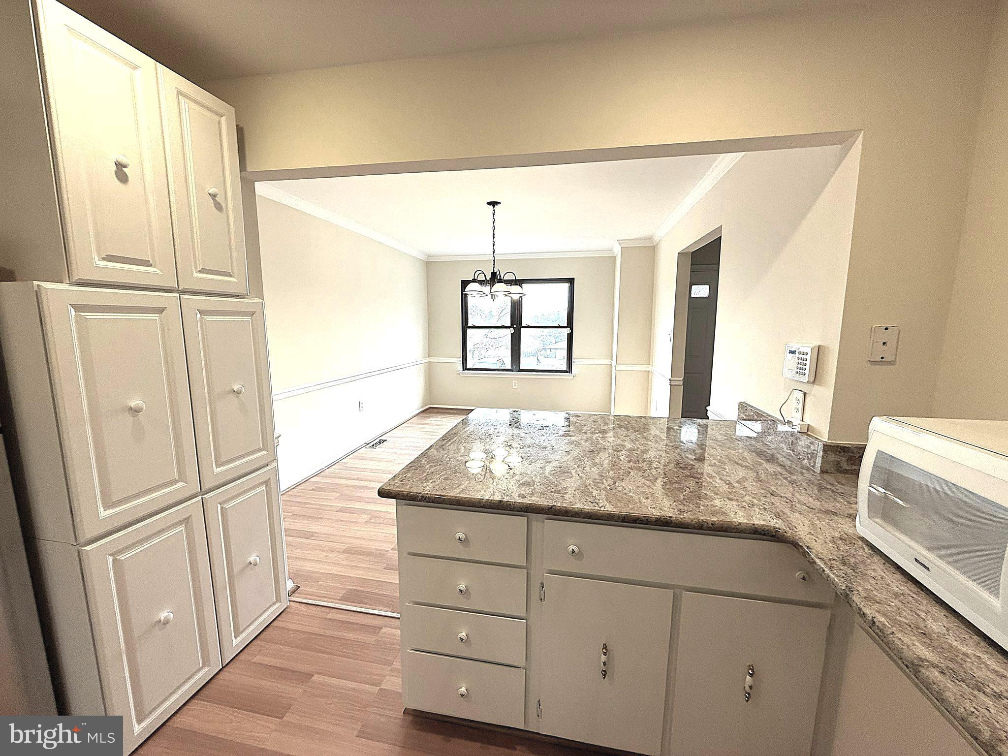 261 Bishop Drive Aston, PA 19014 - Photo 14 of 36 a bathroom with a granite countertop sink and a mirror