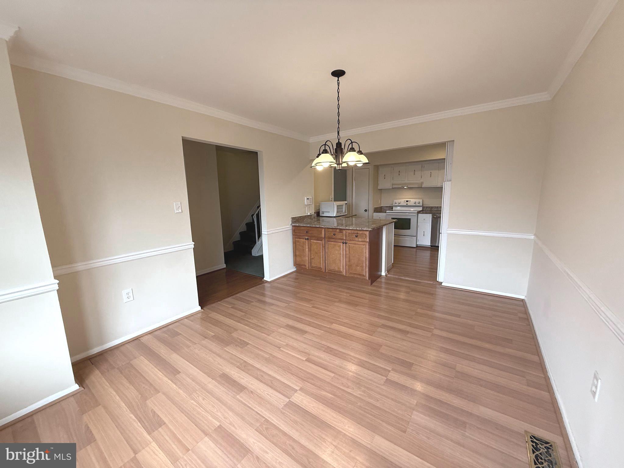 261 Bishop Drive Aston, PA 19014 - Photo 16 of 36 a view of a kitchen with a sink dishwasher a refrigerator and wooden floor