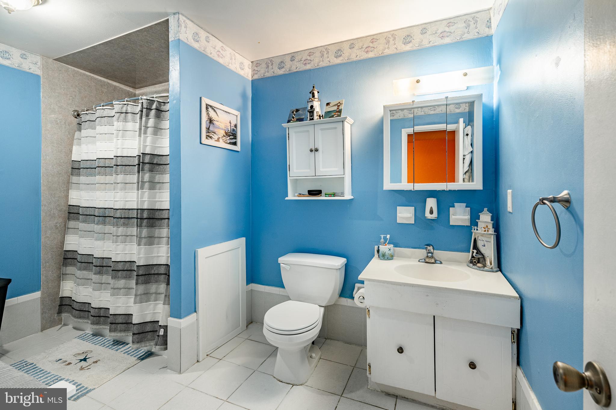 261 Bishop Drive Aston, PA 19014 - Photo 20 of 36 a bathroom with a toilet sink and mirror