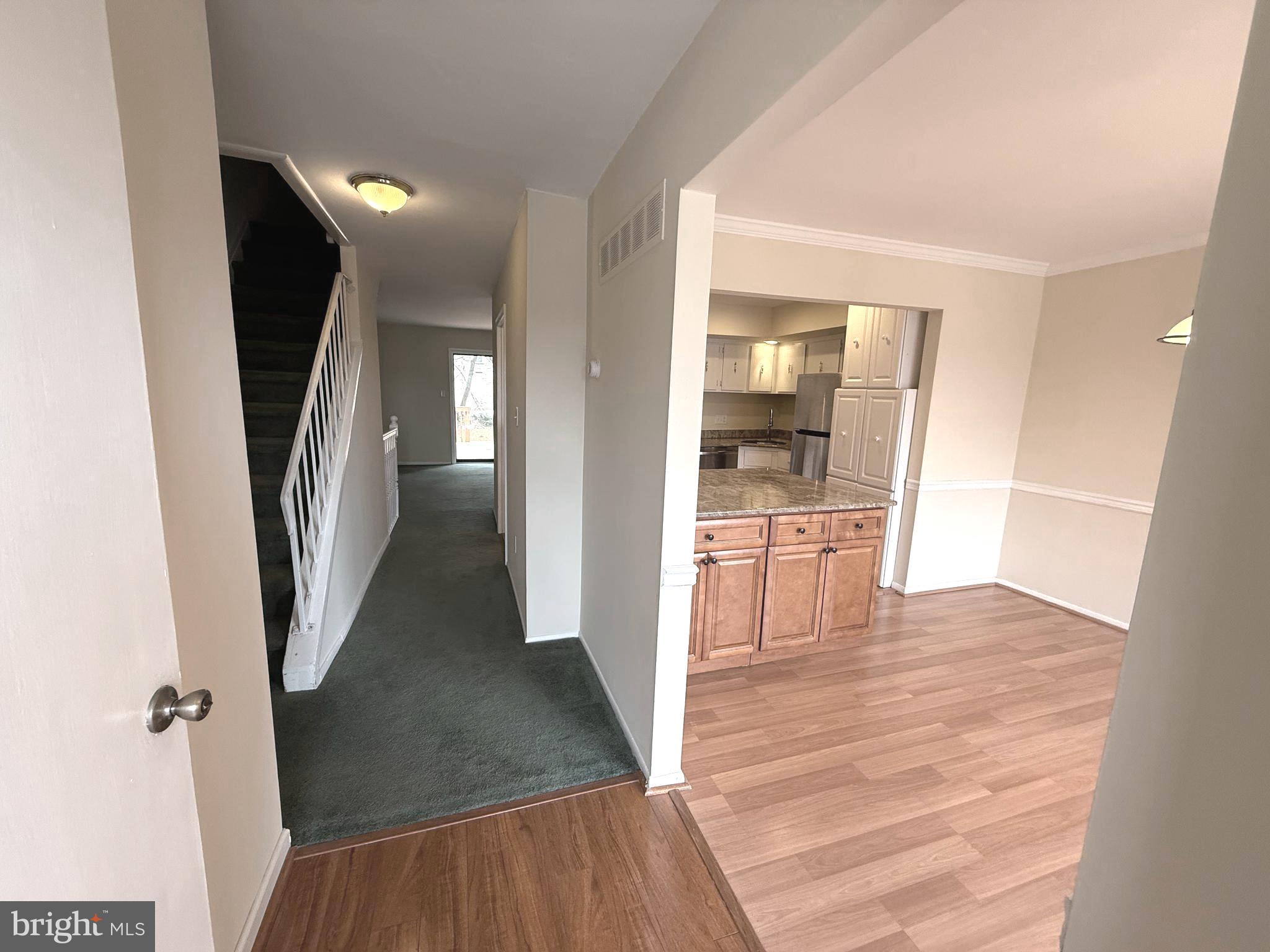 261 Bishop Drive Aston, PA 19014 - Photo 7 of 36 a view of a hallway view with wooden floor and staircase