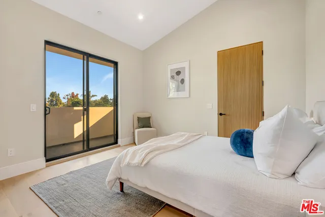 a kitchen with a sink a stove and a refrigerator