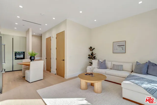 a table and chairs in front of a building