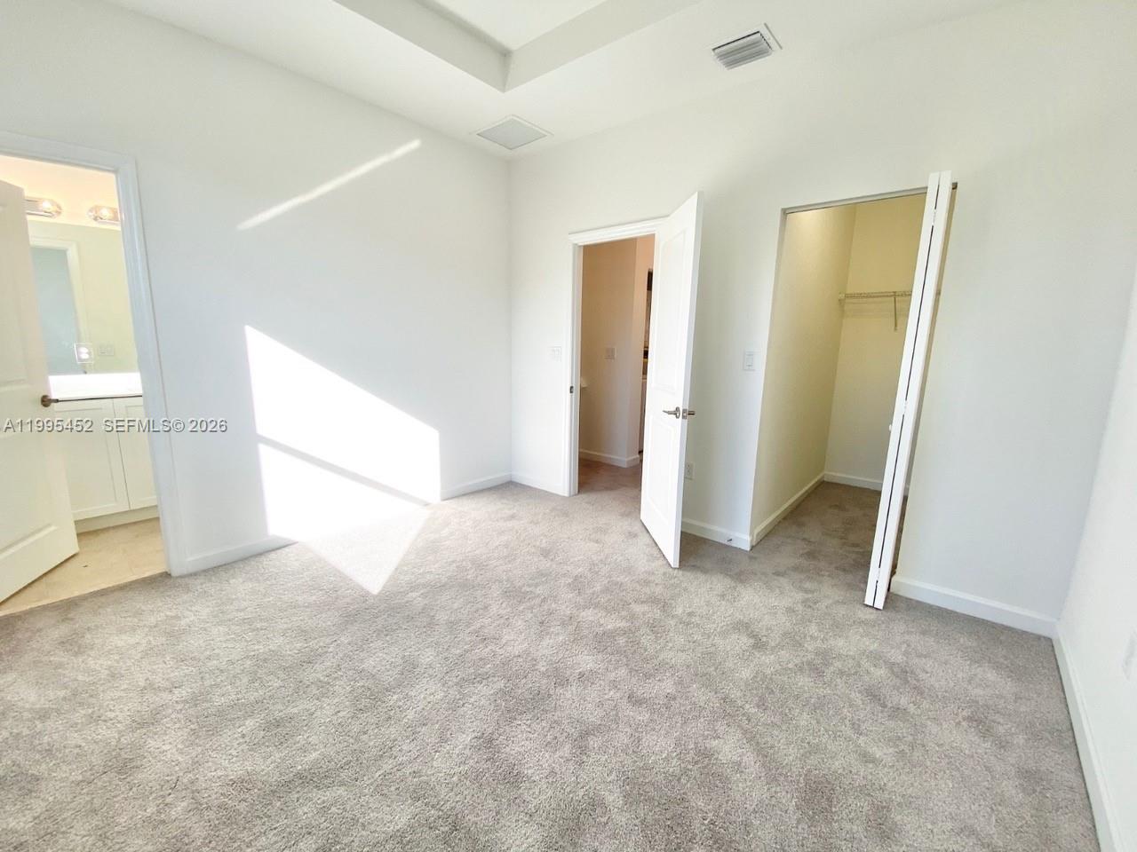 24920 Southwest 112th Court Homestead, FL 33032 - Photo 16 of 48 an empty room with windows