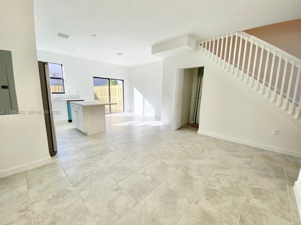 24920 Southwest 112th Court Homestead, FL 33032 - Photo 2 of 48 a view of a living room with windows