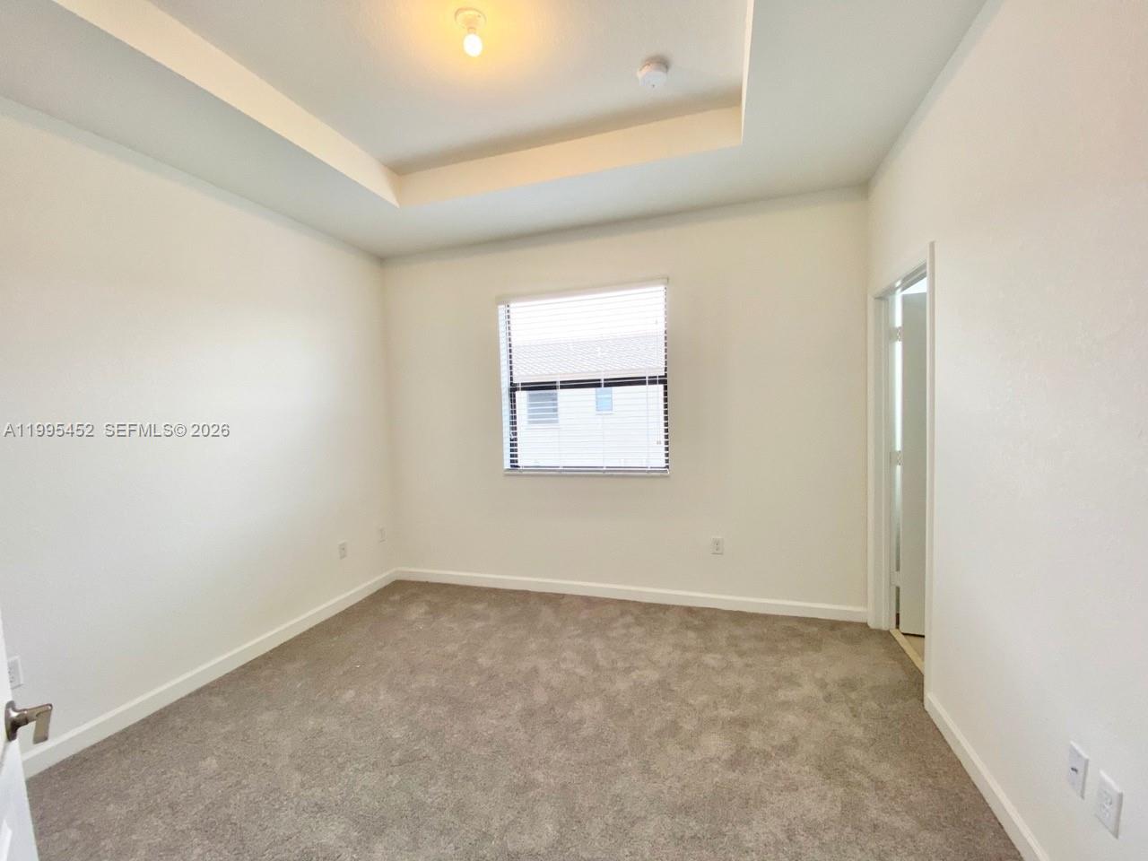 24920 Southwest 112th Court Homestead, FL 33032 - Photo 21 of 48 an empty room with a window