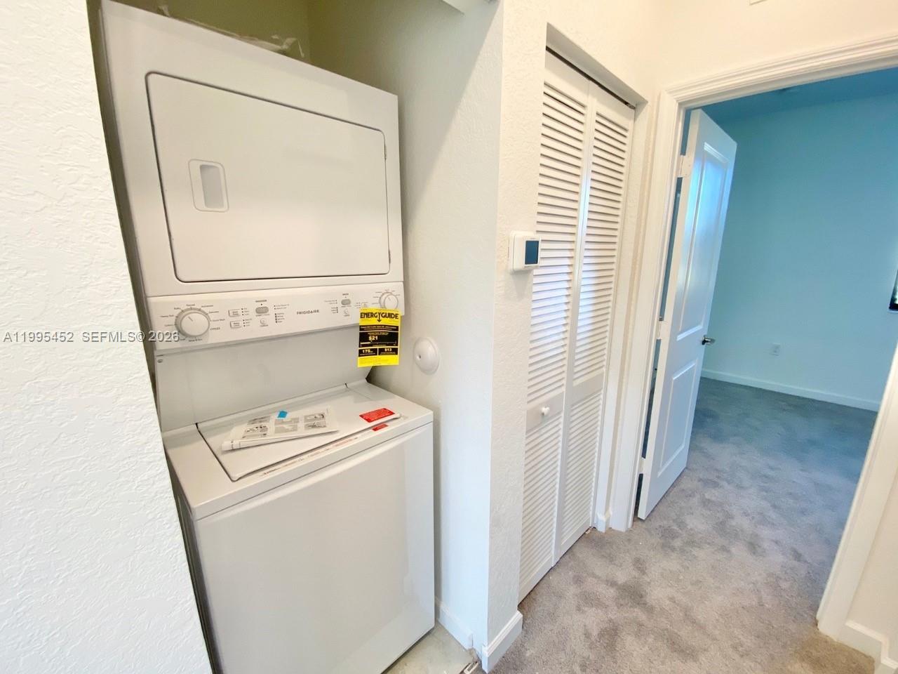 24920 Southwest 112th Court Homestead, FL 33032 - Photo 30 of 48 a utility room with dryer and washer