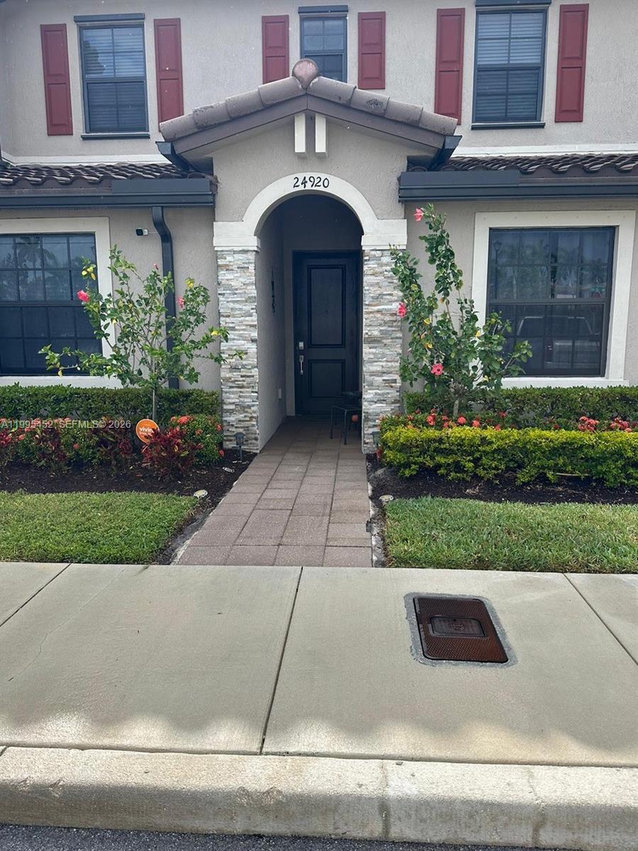 24920 Southwest 112th Court Homestead, FL 33032 - Photo 34 of 48 a front view of a house with a yard
