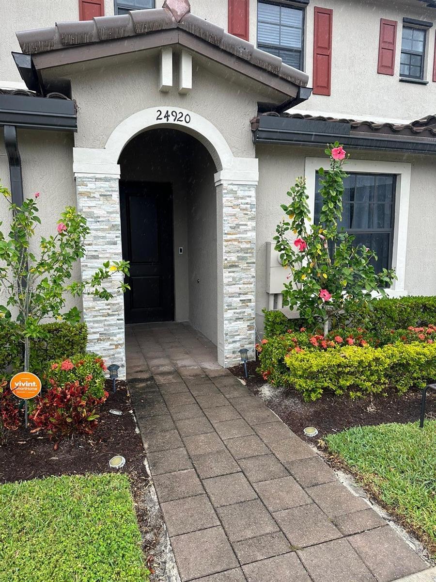24920 Southwest 112th Court Homestead, FL 33032 - Photo 35 of 48 a front view of a house with plants