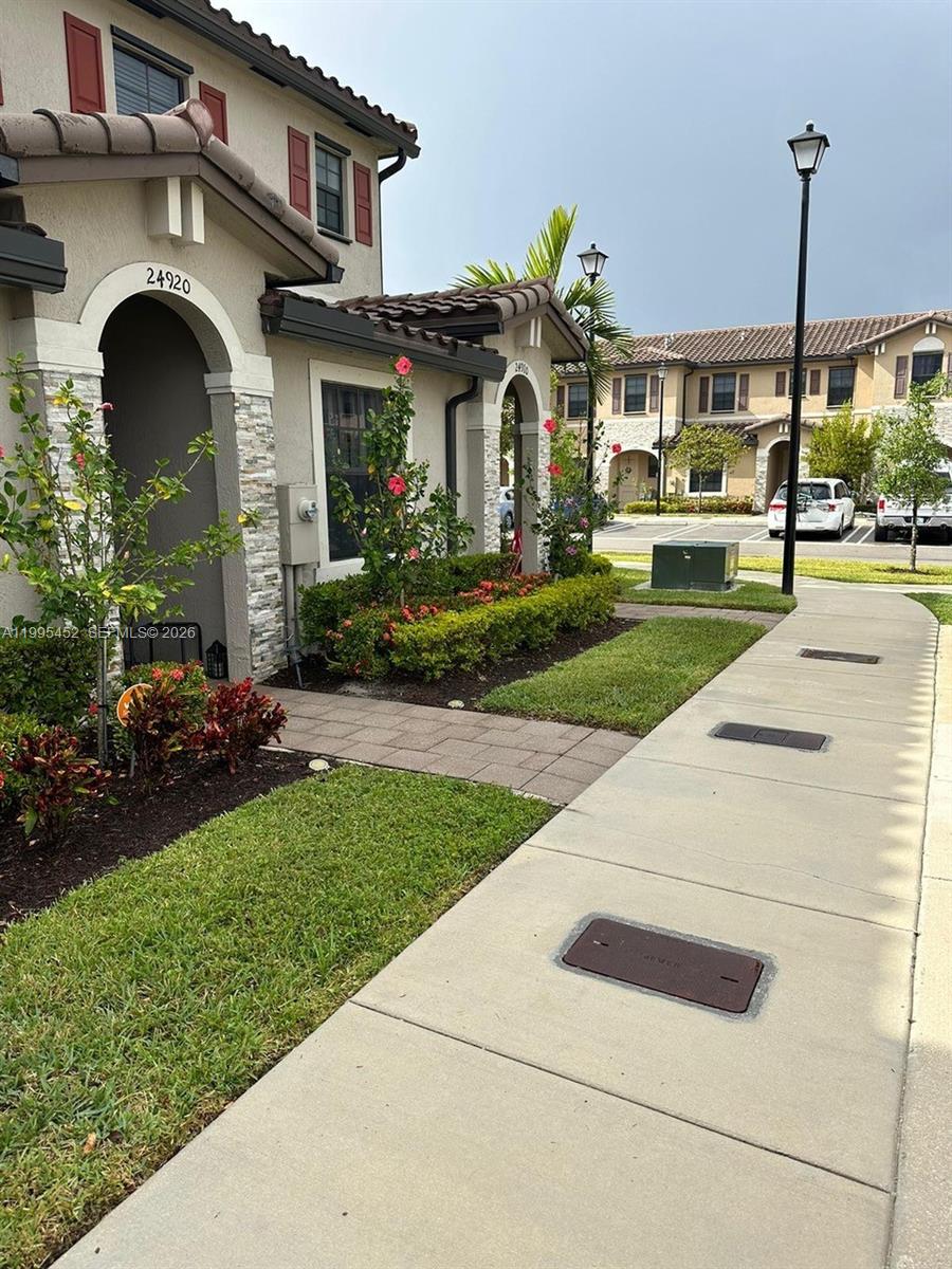 24920 Southwest 112th Court Homestead, FL 33032 - Photo 36 of 48 a front view of a house with a yard