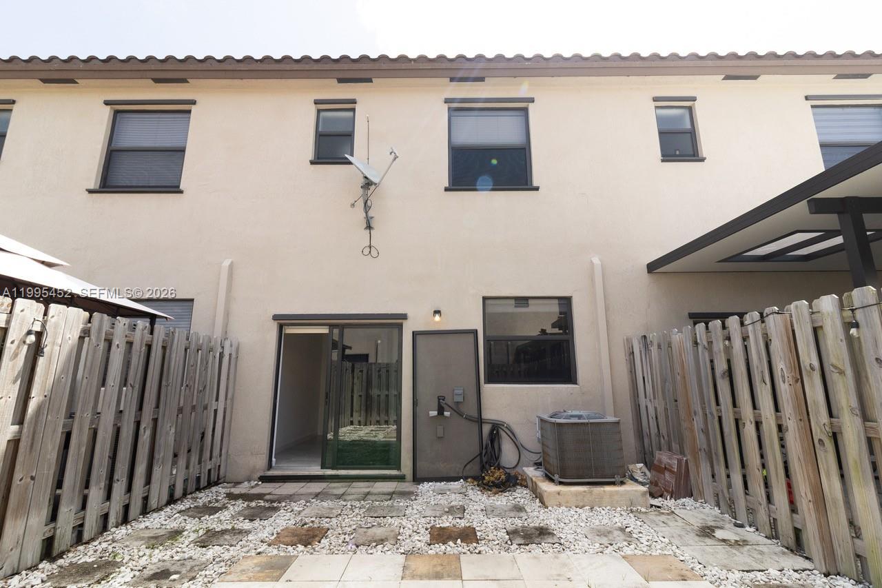 24920 Southwest 112th Court Homestead, FL 33032 - Photo 39 of 48 a view of a house with backyard space and wooden deck