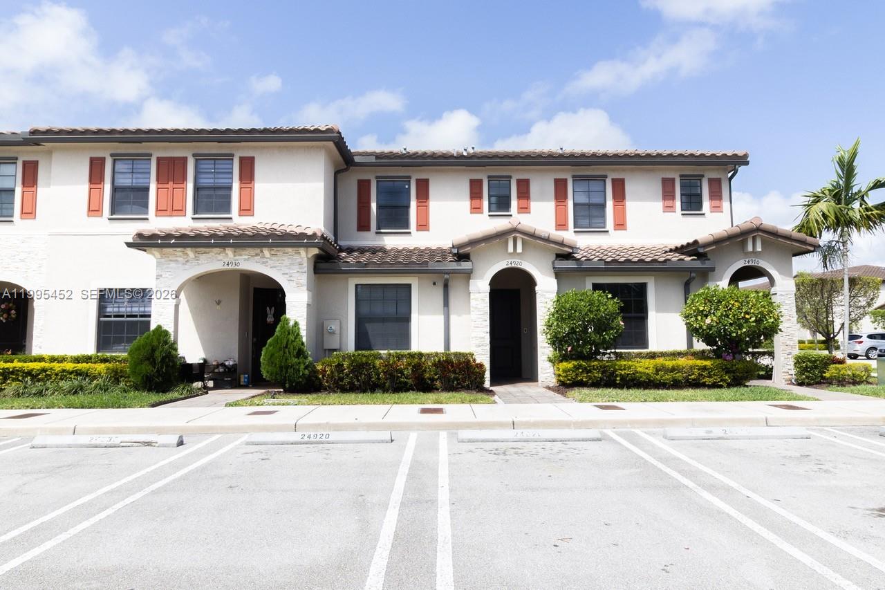 24920 Southwest 112th Court Homestead, FL 33032 - Photo 40 of 48 a front view of a house with a yard