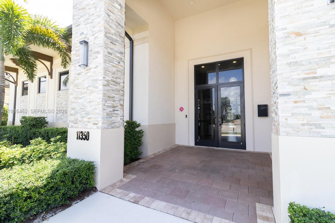 24920 Southwest 112th Court Homestead, FL 33032 - Photo 42 of 48 a view of a front door of a house
