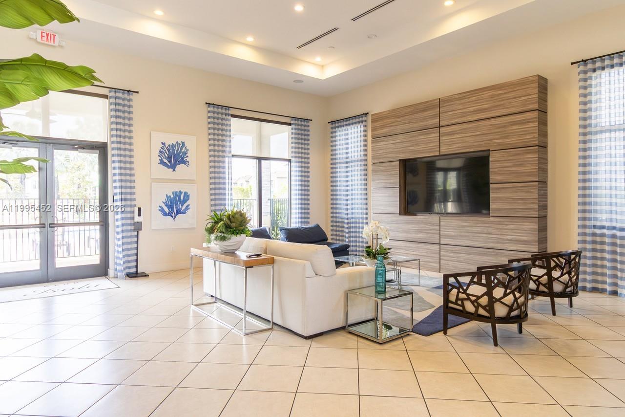24920 Southwest 112th Court Homestead, FL 33032 - Photo 44 of 48 a living room with furniture and a flat screen tv