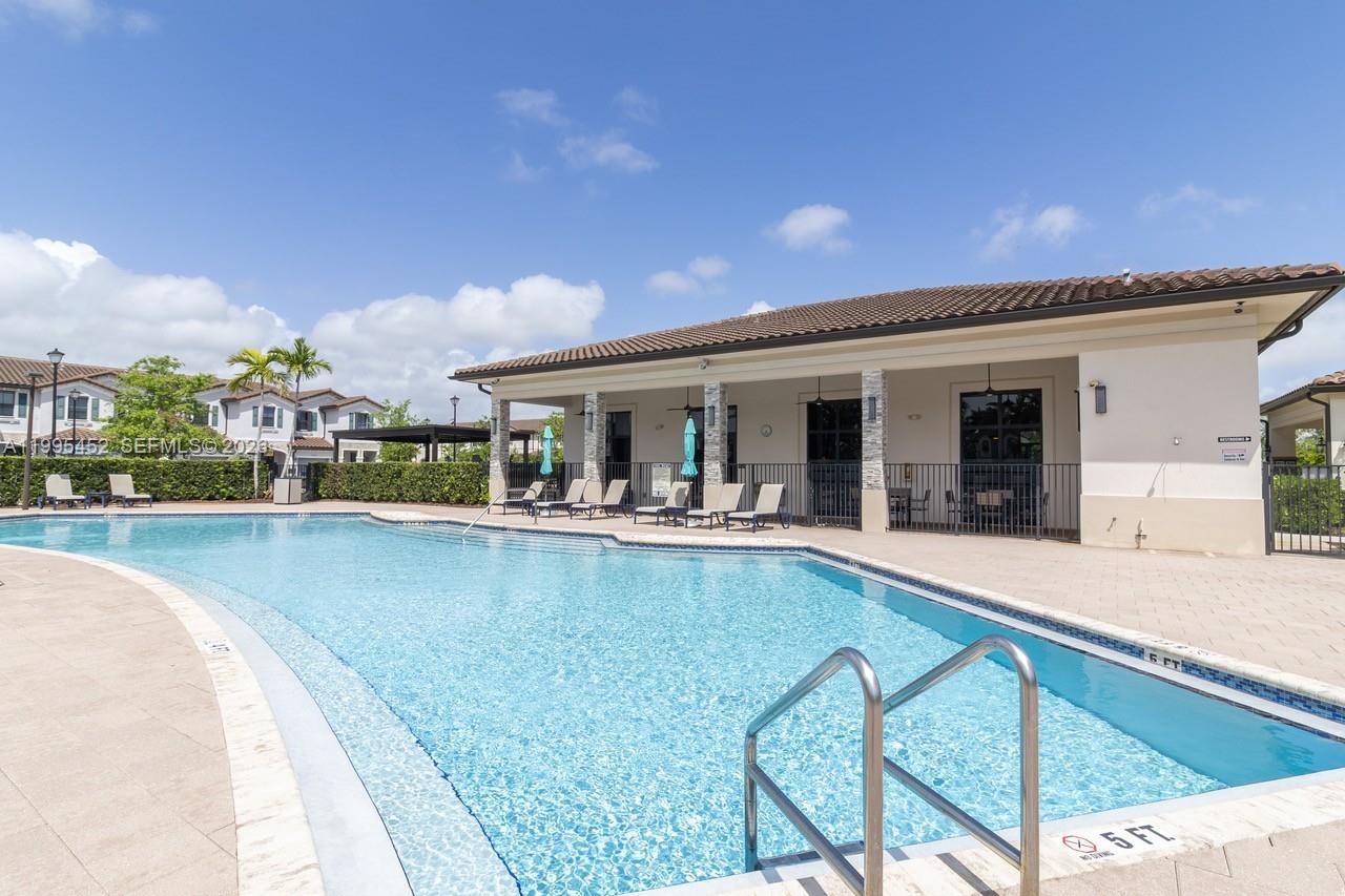 24920 Southwest 112th Court Homestead, FL 33032 - Photo 46 of 48 a view of a house with swimming pool and sitting area